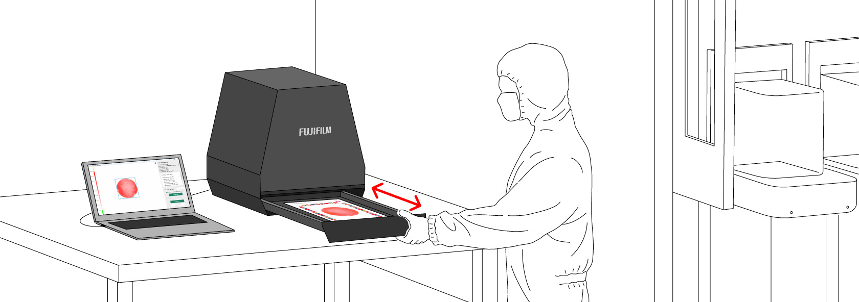 発色したプレスケールを読み取り装置の引出し内に設置